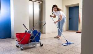 Cleaning - lady cleaning office hall floor.jpg 1