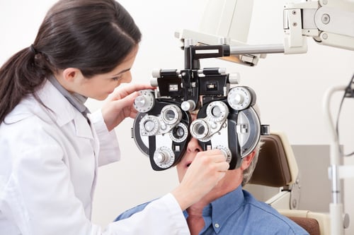 Optometrist - Dr giving eye test